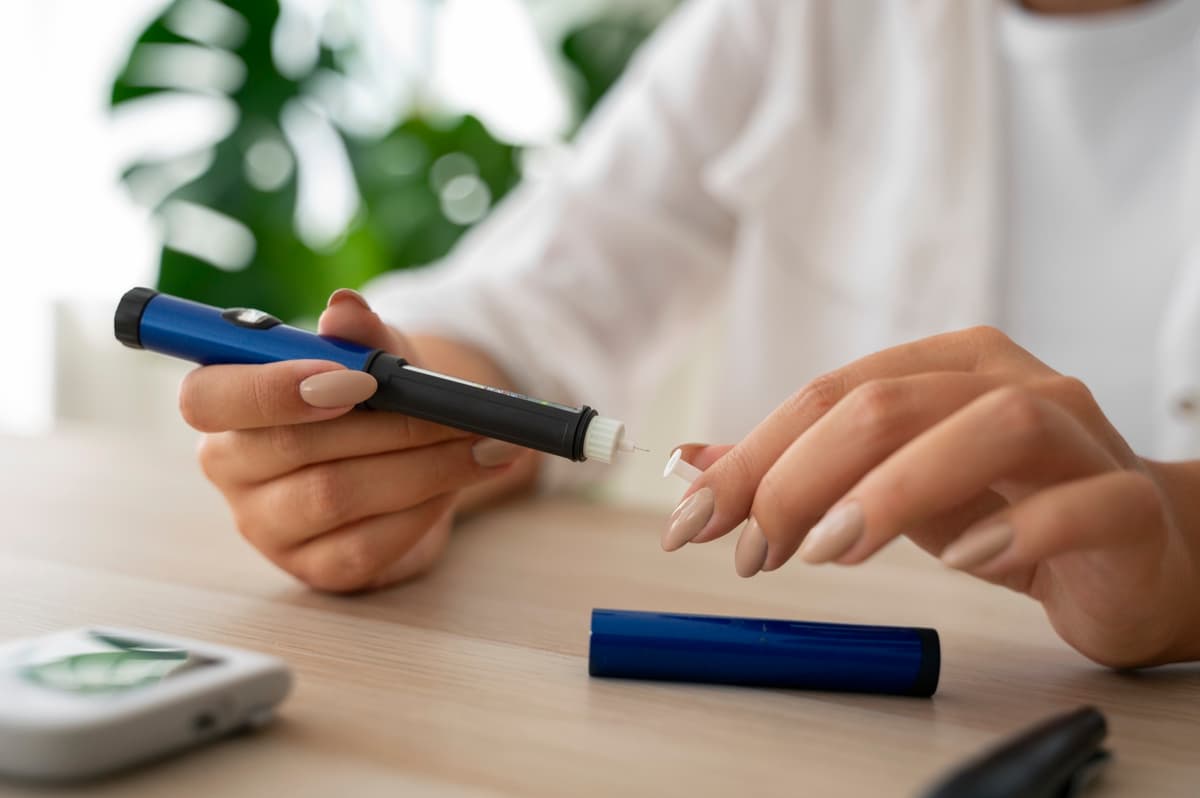 Woman preparing a GLP-1 injection pen